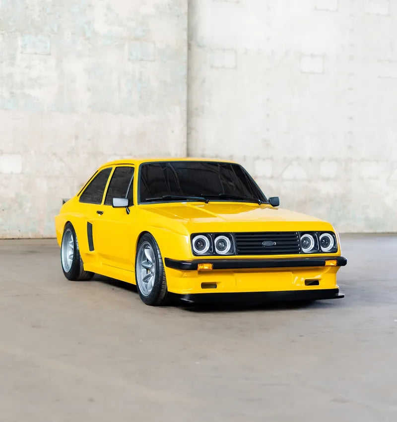Bespoke one-off headlights on a yellow Ford Escort Mk2