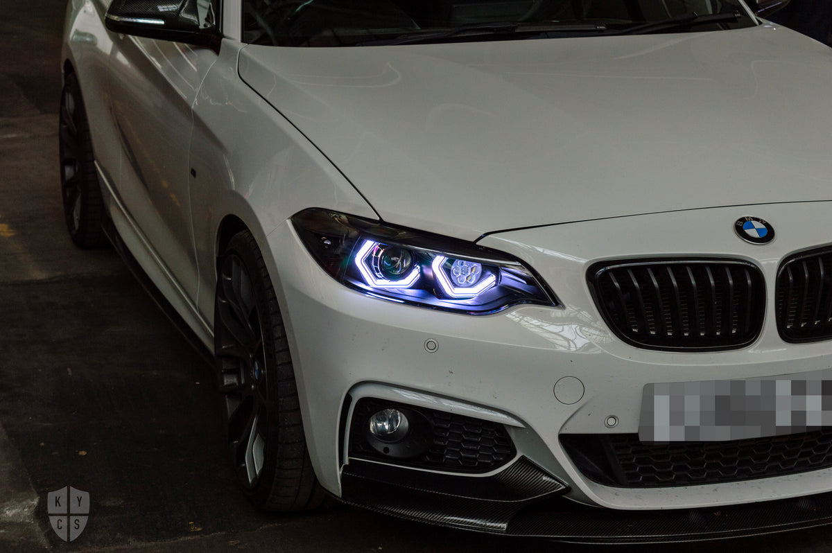 BMW 2 Series E87 & F22 F23 F87 (Pre LCI Halogen) Custom Headlights. Equipped With The Following Options: BavGruppe Design Vision Angel Eyes (White) | Bi-LED Projector | LED High Beam Array | New Lenses