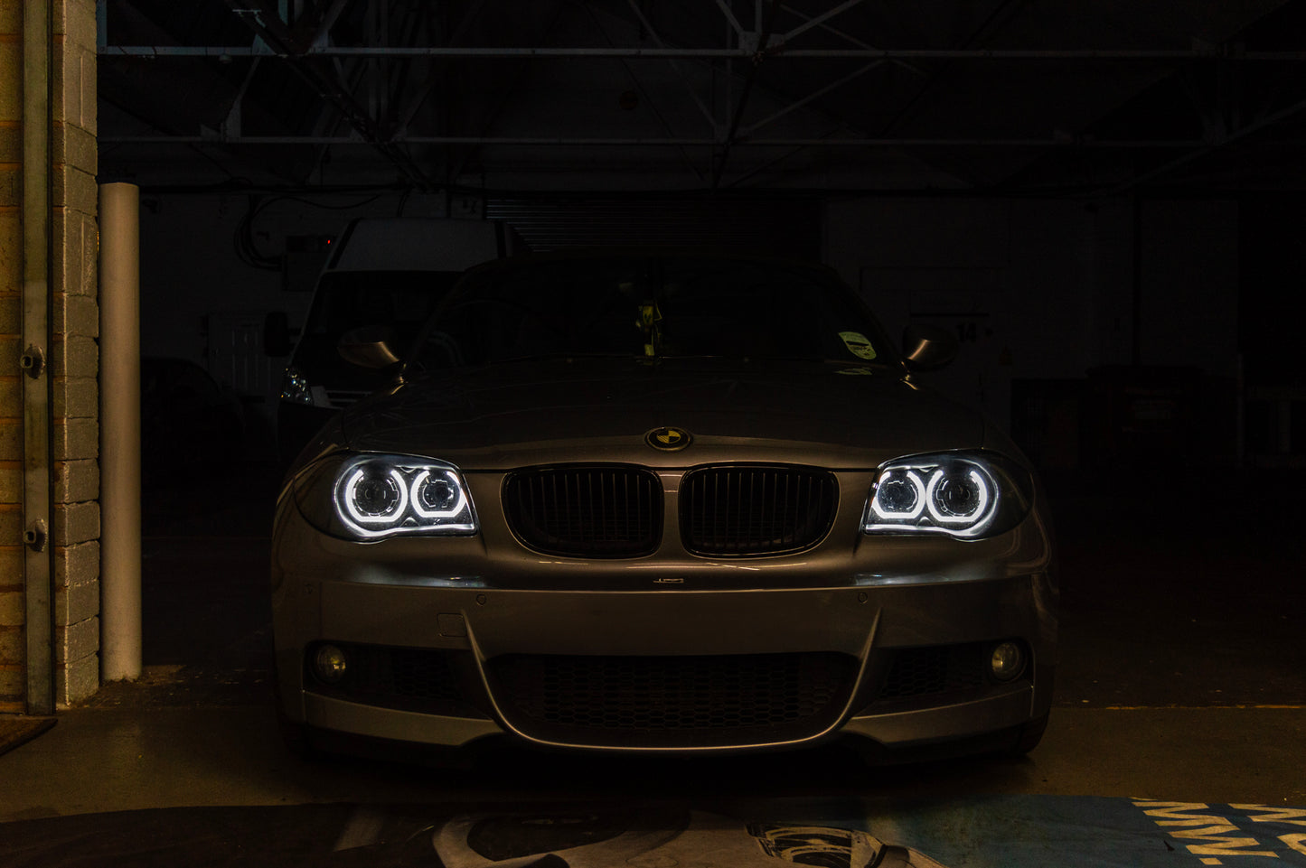 BMW 1 Series E87 & E81 E82 E88 (Pre LCI Halogen) Custom Headlights. Equipped With The Following Options: KYCS DTM Angel Eyes (White) | Bi-LED Projector