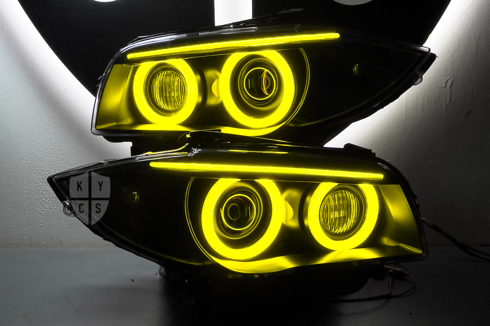 BMW 1 Series E87 & E81 E82 E88 (Pre LCI Xenon/Adaptive Xenon) Custom Headlights. Equipped With The Following Options: BavGruppe Design Round Angel Eyes (Dual Colour - White & CSL Yellow) | BavGruppe Design Carbon Fibre Eyebrow With Optic & LED Strip (Dual Colour - White & CSL Yellow) | G5-BRT Projector & Brackets (Projector Upgrade) | New Headlight Lenses