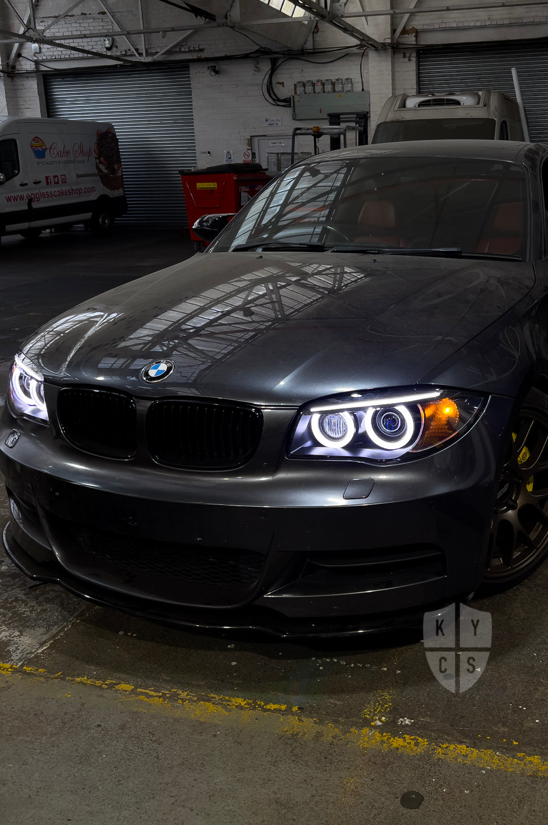 BMW 1 Series E87 & E81 E82 E88 (Pre LCI Xenon/Adaptive Xenon) Custom Headlights. Equipped With The Following Options: BavGruppe Design Round Angel Eyes (White) | BavGruppe Design Carbon Fibre Eyebrow With Optic & LED Strip (White) | G5-BRT Projector & Brackets (Projector Upgrade) | New Headlight Lenses
