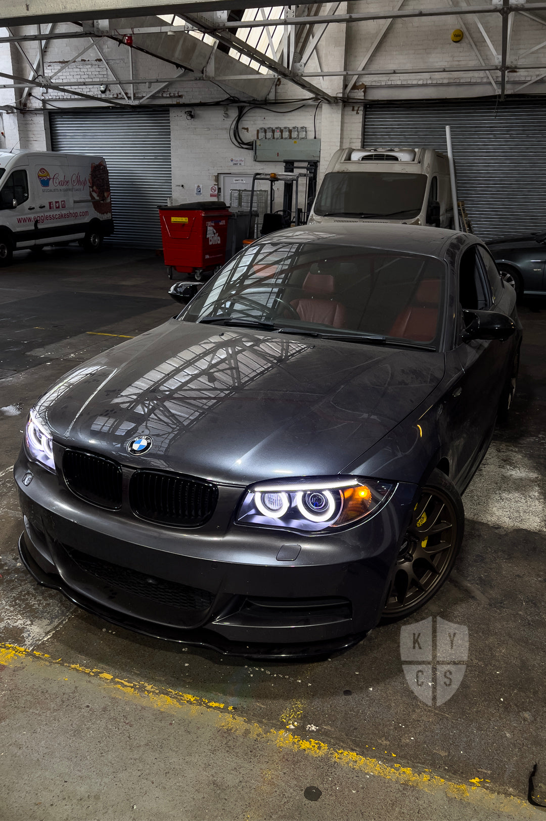 BMW 1 Series E87 & E81 E82 E88 (Pre LCI Xenon/Adaptive Xenon) Custom Headlights. Equipped With The Following Options: BavGruppe Design Round Angel Eyes (White) | BavGruppe Design Carbon Fibre Eyebrow With Optic & LED Strip (White) | G5-BRT Projector & Brackets (Projector Upgrade) | New Headlight Lenses