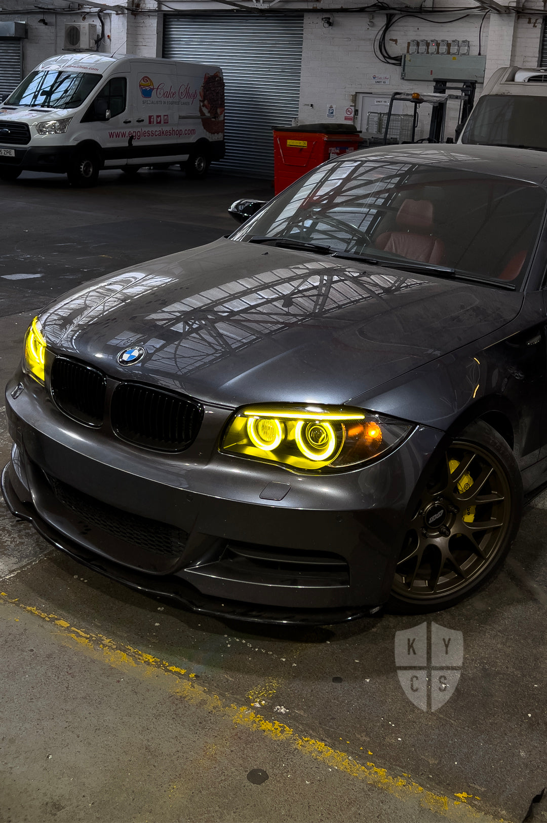 BMW 1 Series E87 & E81 E82 E88 (Pre LCI Xenon/Adaptive Xenon) Custom Headlights. Equipped With The Following Options: BavGruppe Design Round Angel Eyes (Dual Colour - White & CSL Yellow) | BavGruppe Design Carbon Fibre Eyebrow With Optic & LED Strip (Dual Colour - White & CSL Yellow) | G5-BRT Projector & Brackets (Projector Upgrade) | New Headlight Lenses