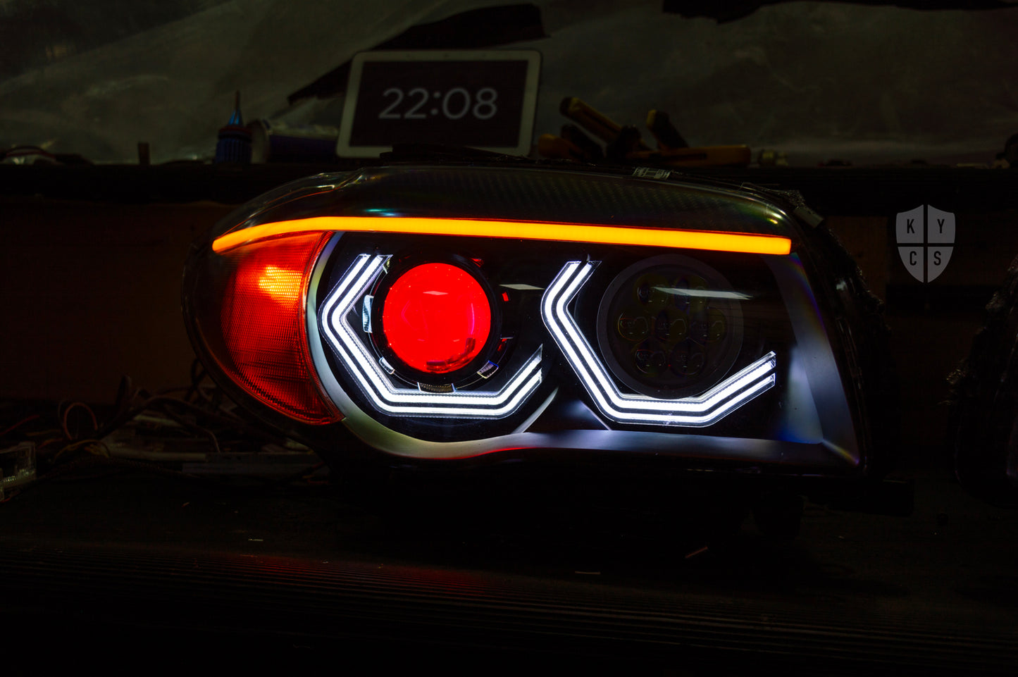 BMW 1 Series E87 & E81 E82 E88 (Pre LCI Halogen) Custom Headlights. Equipped With The Following Options: BavGruppe Design Vision Angel Eyes (White) | BavGruppe Design Carbon Fibre Eyebrow With LED Strip (Switchback) | Bi-LED Projector | LED High Beam Array | Red Demon Eye | New Headlight Lenses