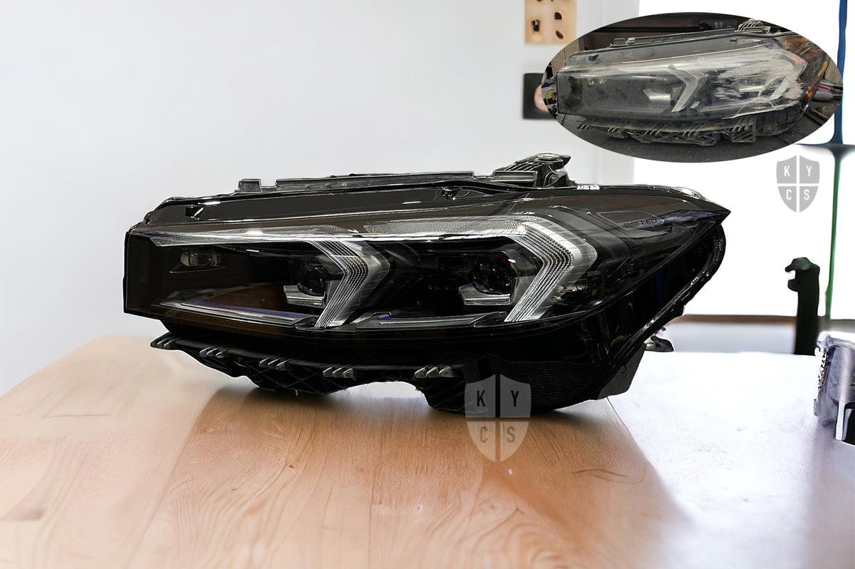 A headlight with a new replacement lens fitted by KYCS