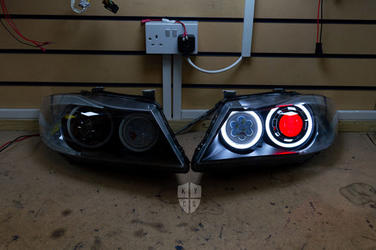 Headlight options on the above vehicle: KYCS (white) angel eyes | Modern blackout | Bi-LED 2.5" projector with LED bulb | Upgraded high beam (high beam LED unit array style) | Red demon eye | New headlight plastic lenses/covers | LED indicators