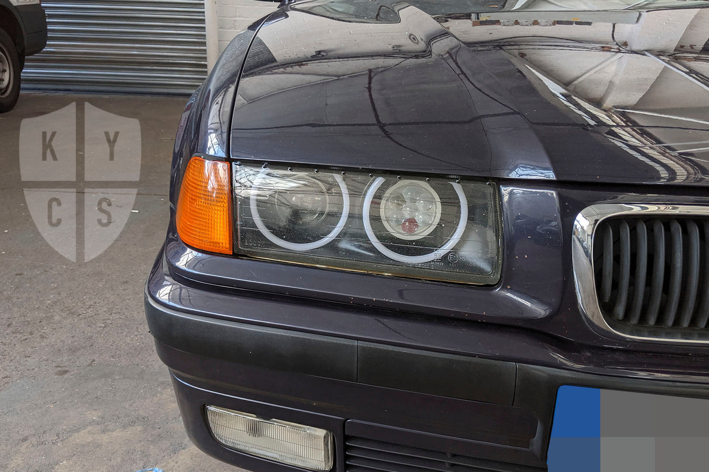 BMW 3 Series E36 (Halogen) Custom Headlights. Equipped With The Following Options: KYCS Full Circle Flat Top Angel Eyes (White) | G5 Upgraded Xenon Projector | LED High Beam Array