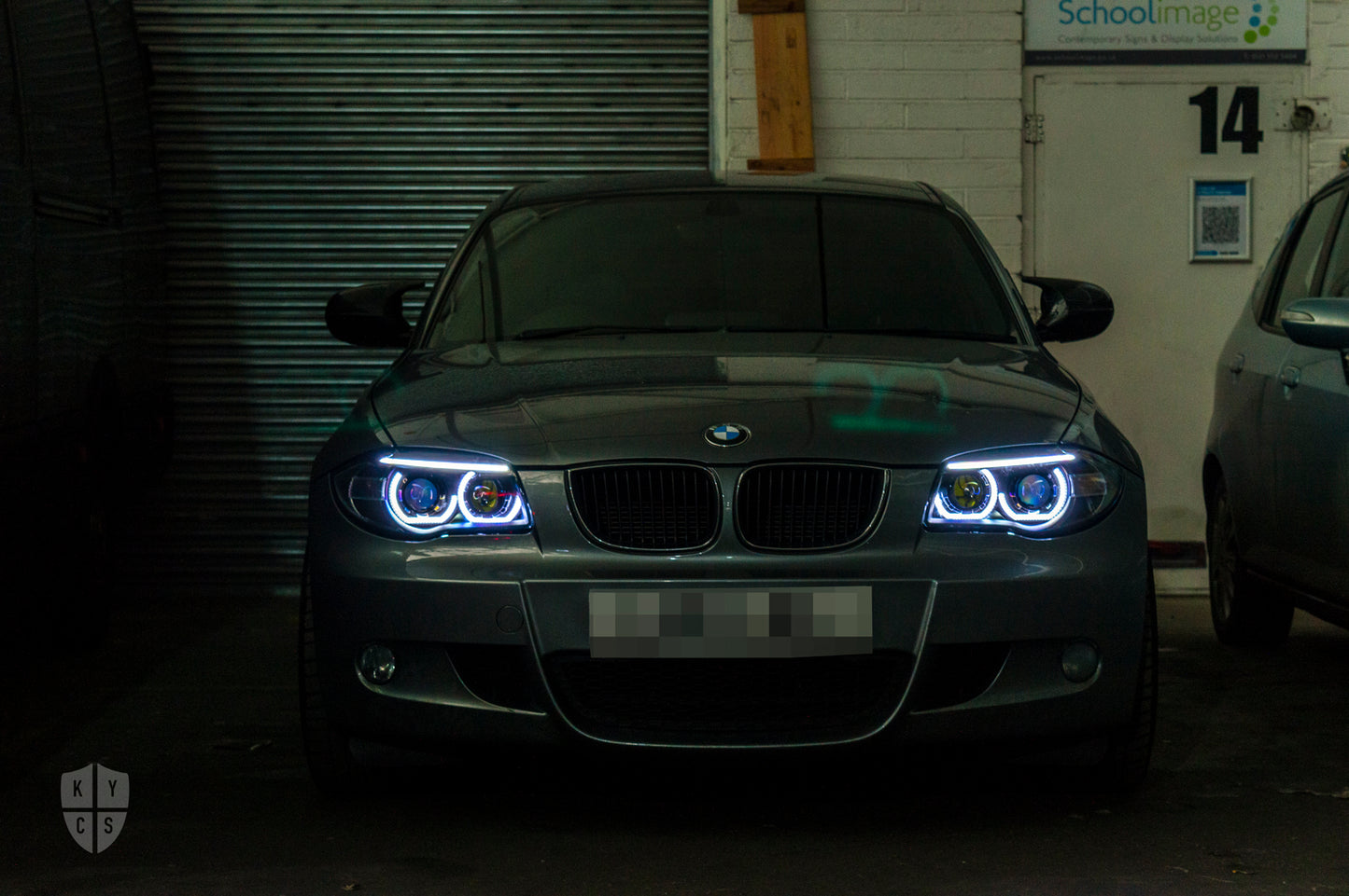 BMW 1 Series E81 E82 E88 (LCI Halogen) Custom Headlights. Equipped With The Following Options: KYCS 3/4 DTM Angel Eyes (White) | BavGruppe Design LED Strip Eyebrow Within OEM Opening (White) | Bi-LED Projector | LED High Beam Projector | New Headlight Lenses