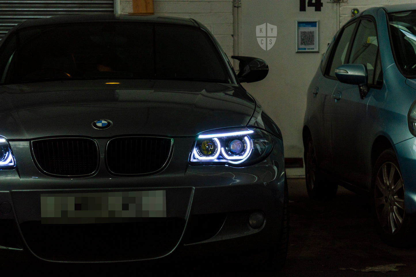BMW 1 Series E81 E82 E88 (LCI Halogen) Custom Headlights. Equipped With The Following Options: KYCS 3/4 DTM Angel Eyes (White) | BavGruppe Design LED Strip Eyebrow Within OEM Opening (White) | Bi-LED Projector | LED High Beam Projector | New Headlight Lenses