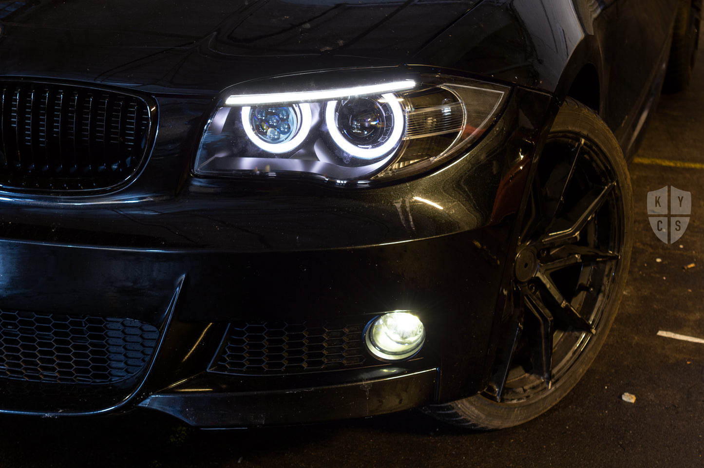 BMW 1 Series E81 E82 E88 (LCI Halogen) Custom Headlights. Equipped With The Following Options: BavGruppe Design Round Angel Eyes (White) | BavGruppe Design LED Strip Eyebrow Within OEM Opening (White) | Bi-LED Projector | LED High Beam Array | New Headlight Lenses