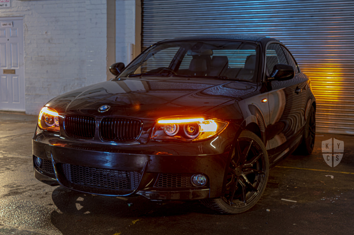 BMW 1 Series E81 E82 E88 (LCI Halogen) Custom Headlights. Equipped With The Following Options: BavGruppe Design Round Angel Eyes (White) | BavGruppe Design LED Strip Eyebrow Within OEM Opening (Switchback) | Bi-LED Projector | LED High Beam Array | New Headlight Lenses
