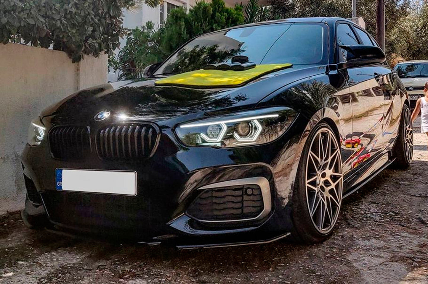 BMW 1 Series F20 F21 (LCI Halogen) Custom Headlights. Equipped With The Following Options: BavGruppe Design Vision Angel Eyes (White) | BavGruppe Design Full Length LED Strip Eyebrow (White) |Bi-LED Projector | LED High Beam Array | New Headlight Lenses