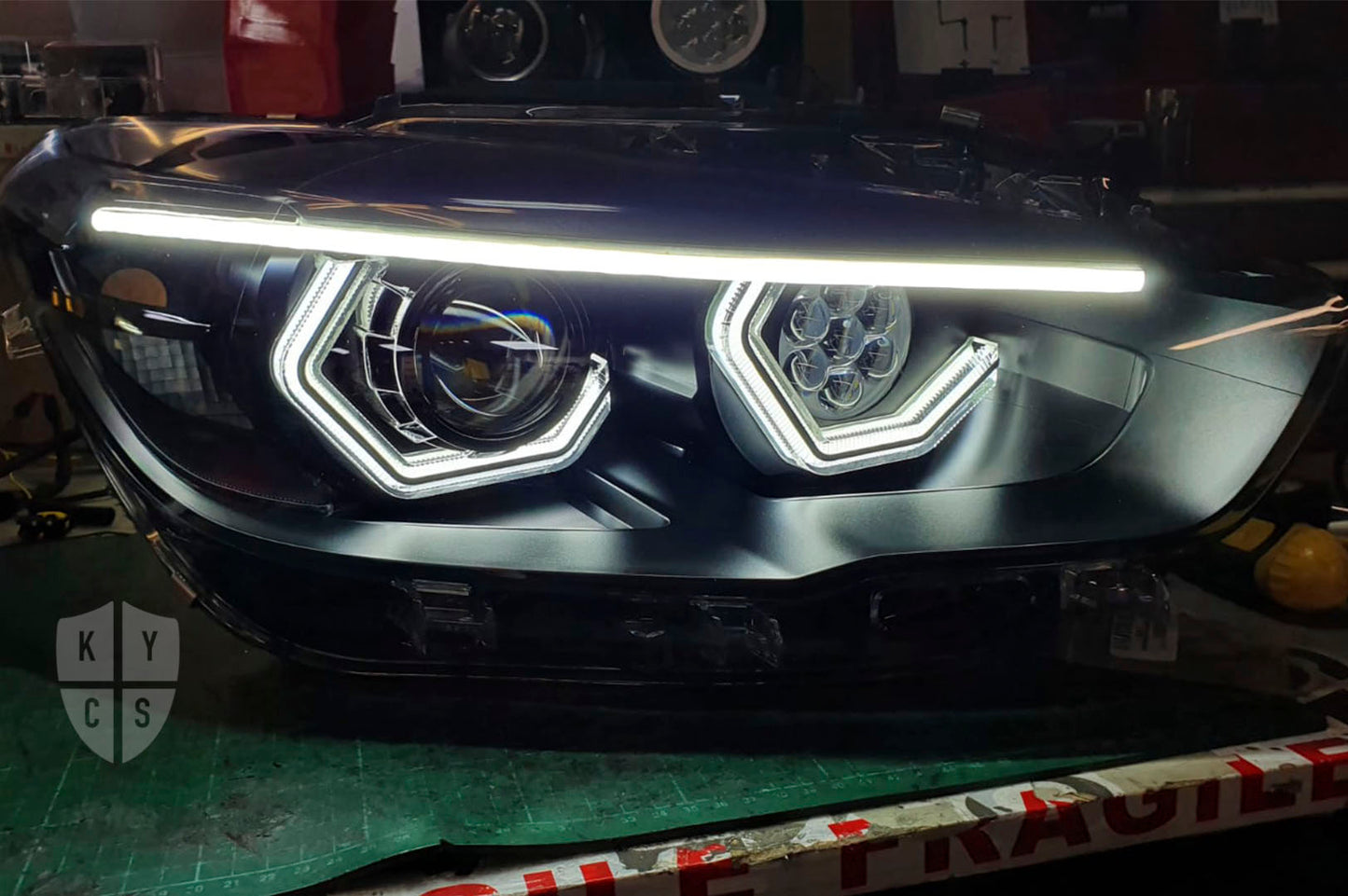 BMW 1 Series F20 F21 (LCI Halogen) Custom Headlights. Equipped With The Following Options: BavGruppe Design Vision Angel Eyes (White) | BavGruppe Design Full Length LED Strip Eyebrow (White) |Bi-LED Projector | LED High Beam Array | New Headlight Lenses