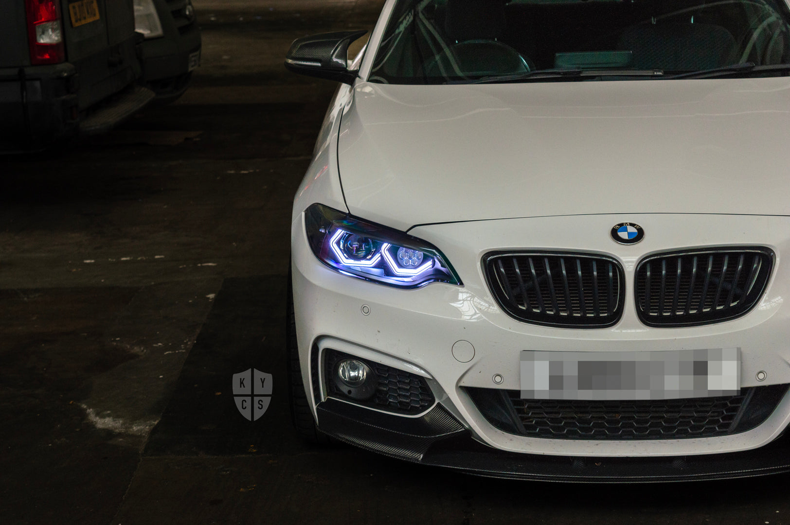 BMW 2 Series E87 & F22 F23 F87 (Pre LCI Halogen) Custom Headlights. Equipped With The Following Options: BavGruppe Design Vision Angel Eyes (White) | Bi-LED Projector | LED High Beam Array | New Lenses

