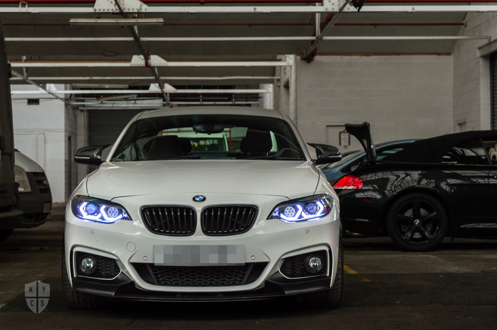 BMW 2 Series E87 & F22 F23 F87 (Pre LCI Halogen) Custom Headlights. Equipped With The Following Options: BavGruppe Design Vision Angel Eyes (White) | Bi-LED Projector | LED High Beam Array | New Lenses
